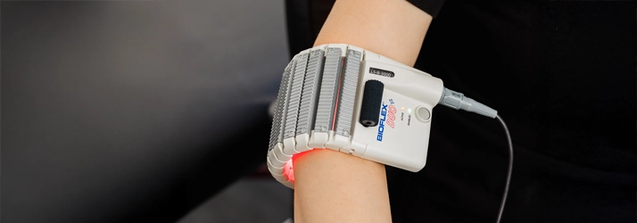 Chiropractic Cabo San Lucas BCS Elbow Hero A patient with cold laser therapy on their elbow.